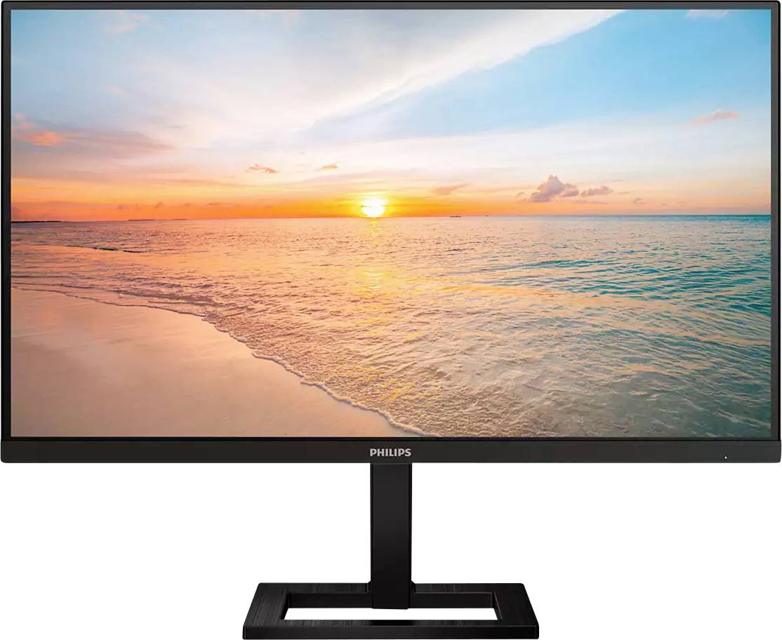 Un écran plat affiche une image vivante d'un coucher de soleil au-dessus de la mer. Le ciel aux couleurs vives et l'eau calme transmettent un sentiment de sérénité.