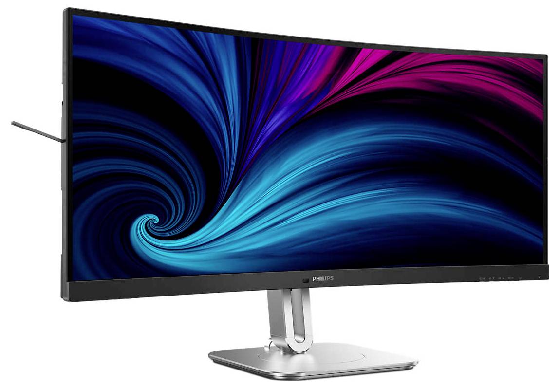 Un moniteur incurvé affiche une image abstraite dans des tons de bleu et de rose. L'écran repose sur un socle argenté.