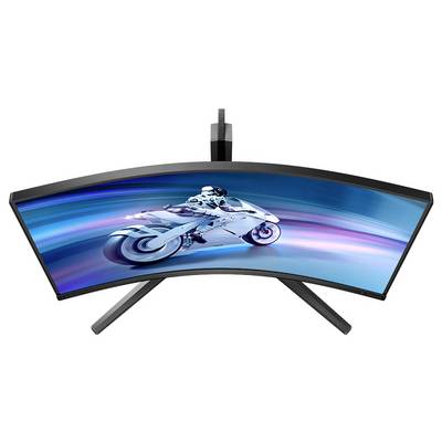 Écran incurvé vu de dessus, affichant une moto futuriste à l'écran, avec des effets de lumière bleus dynamiques en arrière-plan.