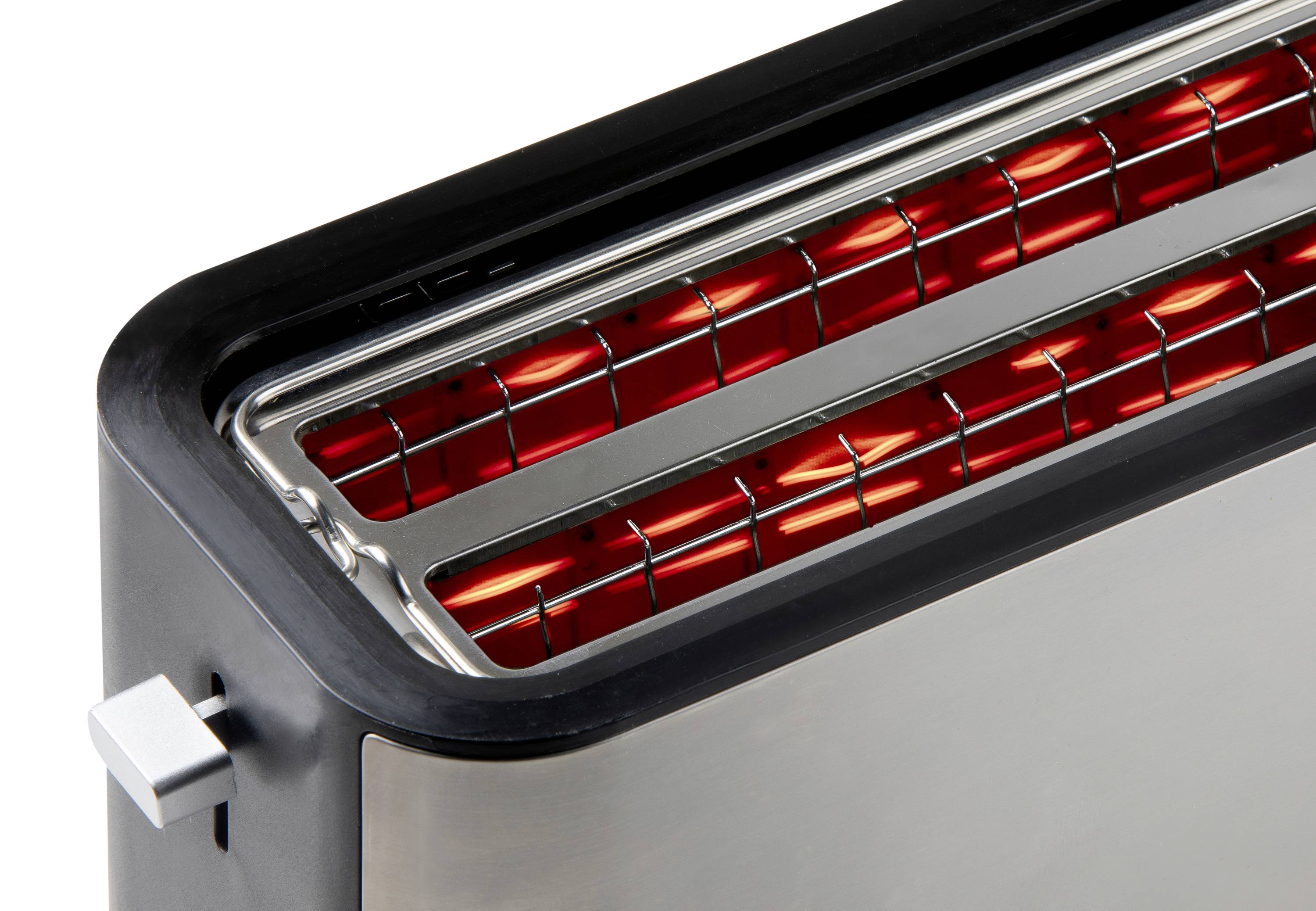 Grille-pain avec des résistances chauffantes incandescentes vues de dessus, montrant le développement de la chaleur.