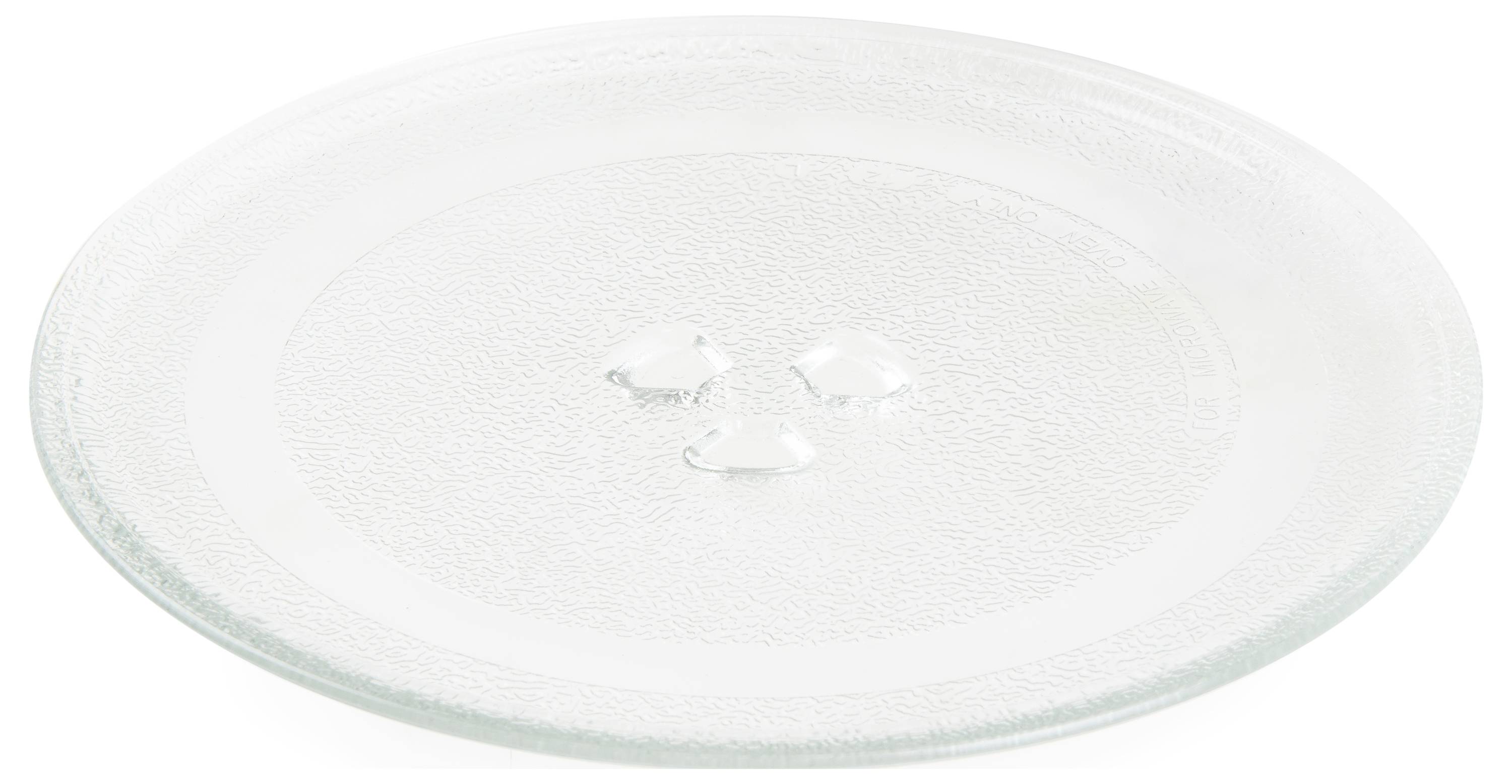 Un plateau tournant rond et transparent en verre, souvent utilisé pour les micro-ondes, est posé sur une surface blanche.