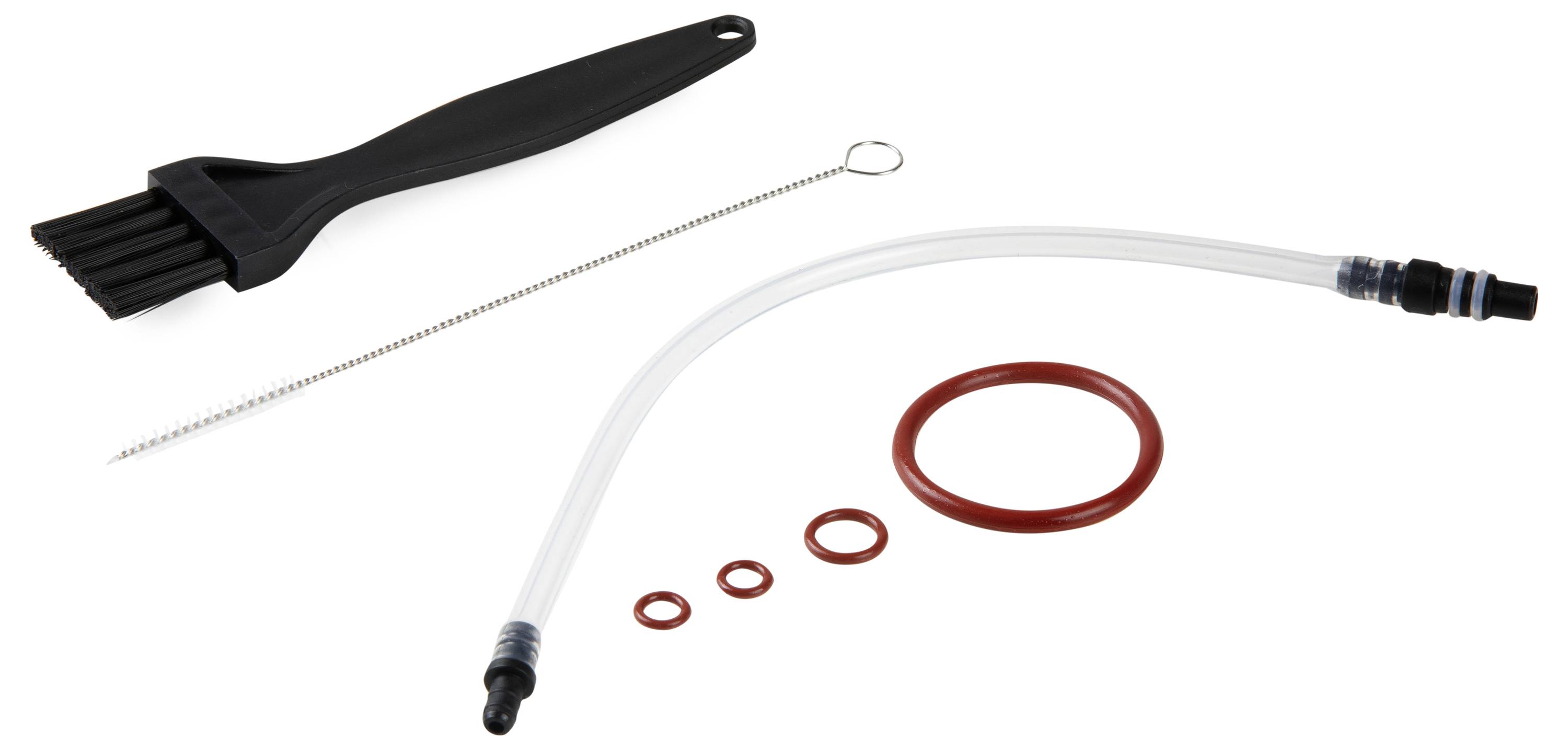 Un ensemble de nettoyage composé d'une brosse noire, d'une brosse métallique, d'un tuyau transparent et de plusieurs joints d'étanchéité.