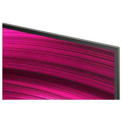 Gros plan sur le coin d'un téléviseur à écran plat avec un fin cadre noir ; l'écran affiche un motif tourbillonnant vif de rose et de noir.
