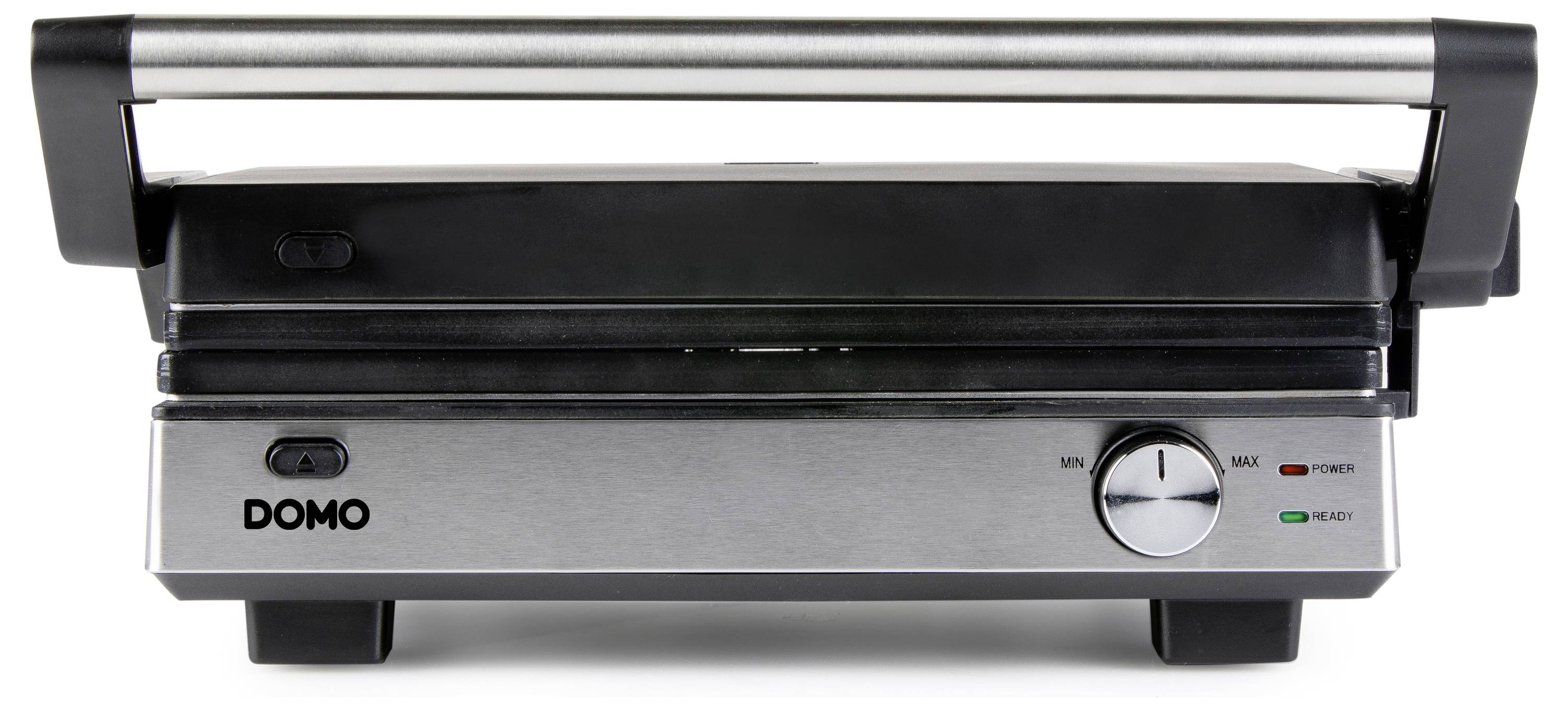 Un appareil de grill électrique à contact avec une surface argentée et noire, équipé d'un régulateur de température et de témoins lumineux, posé sur un plan de travail de cuisine.