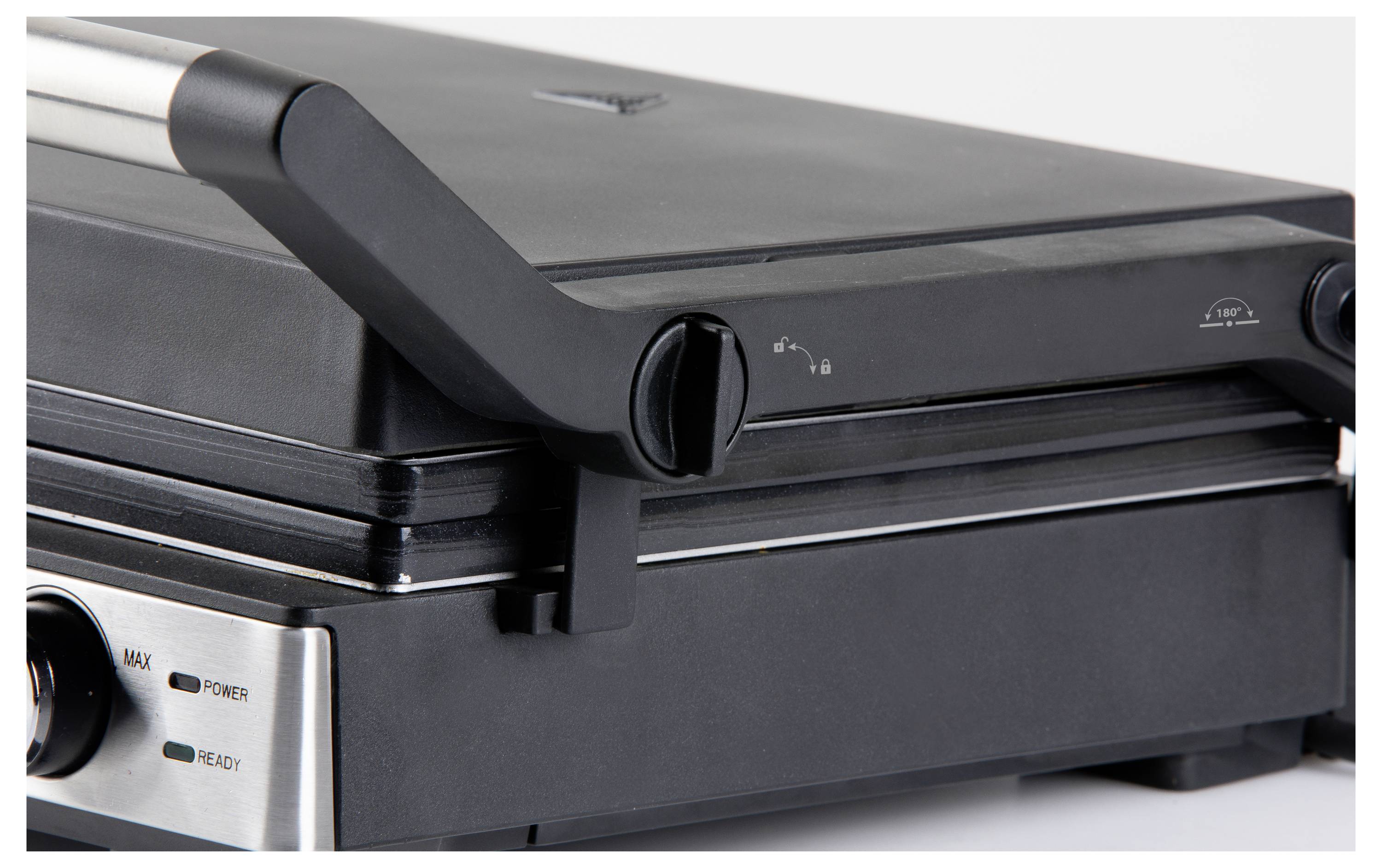 Grill de contact en métal avec boîtier noir et poignée réglable.