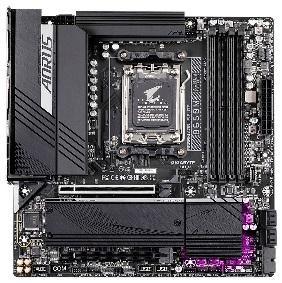 Une carte mère noire de marque Aorus modèle B650M Elite, équipée de plusieurs emplacements d'extension et connecteurs, présentant une conception technique détaillée.