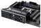 Une carte mère d'ordinateur portant l'inscription 'TUF GAMING', avec plusieurs ports de connexion, des emplacements de mémoire et un socket CPU.
