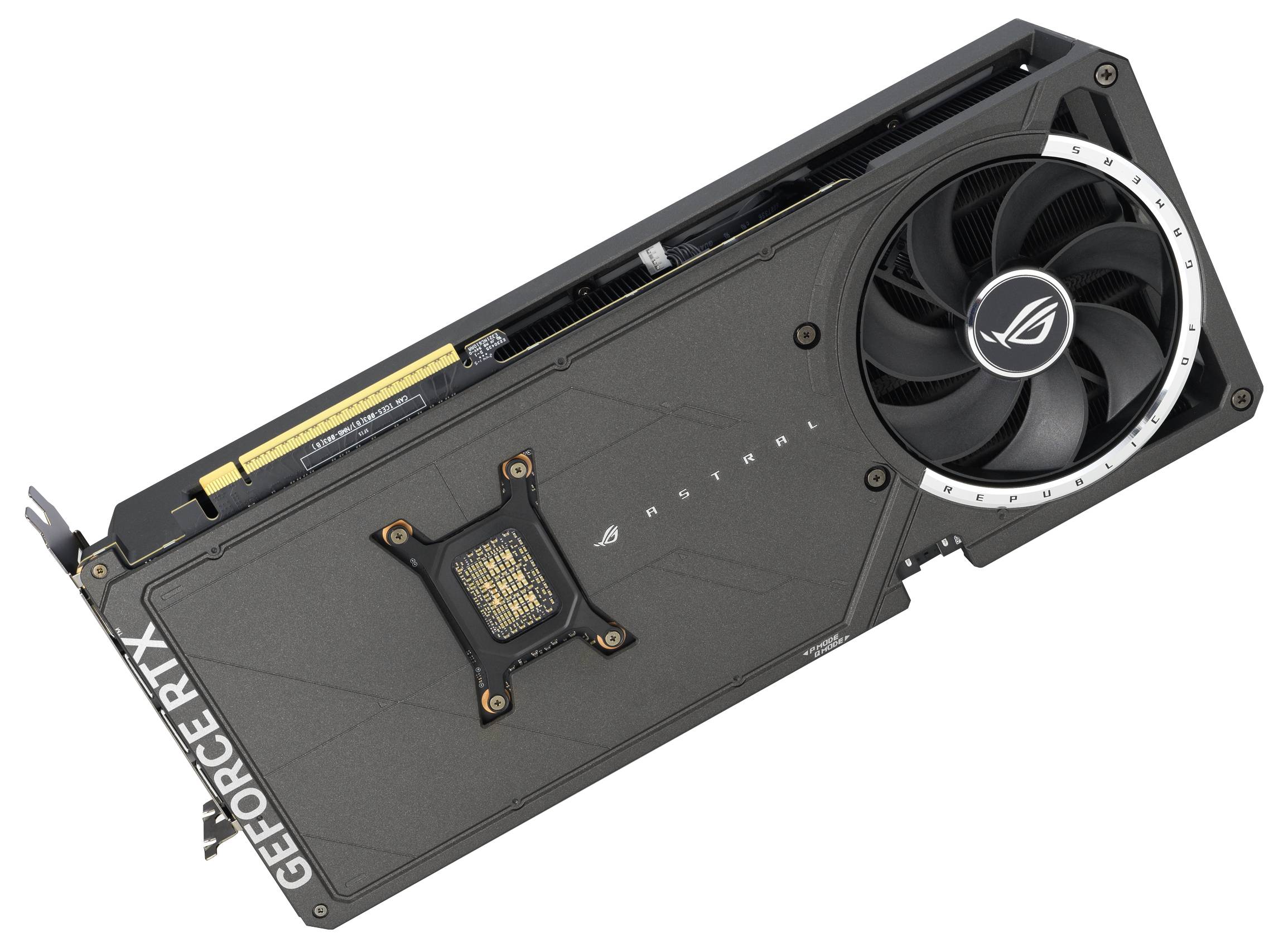 Une carte graphique noire d'ASUS avec de grands ventilateurs, modèle ROG Strix RTX, est posée diagonalement sur le côté.