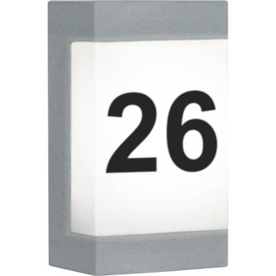 Plaque de numéro de maison portant le numéro 26 en écriture noire sur fond blanc.