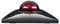 Un trackball noir avec une boule rouge brillante au centre, posé sur une surface lisse.