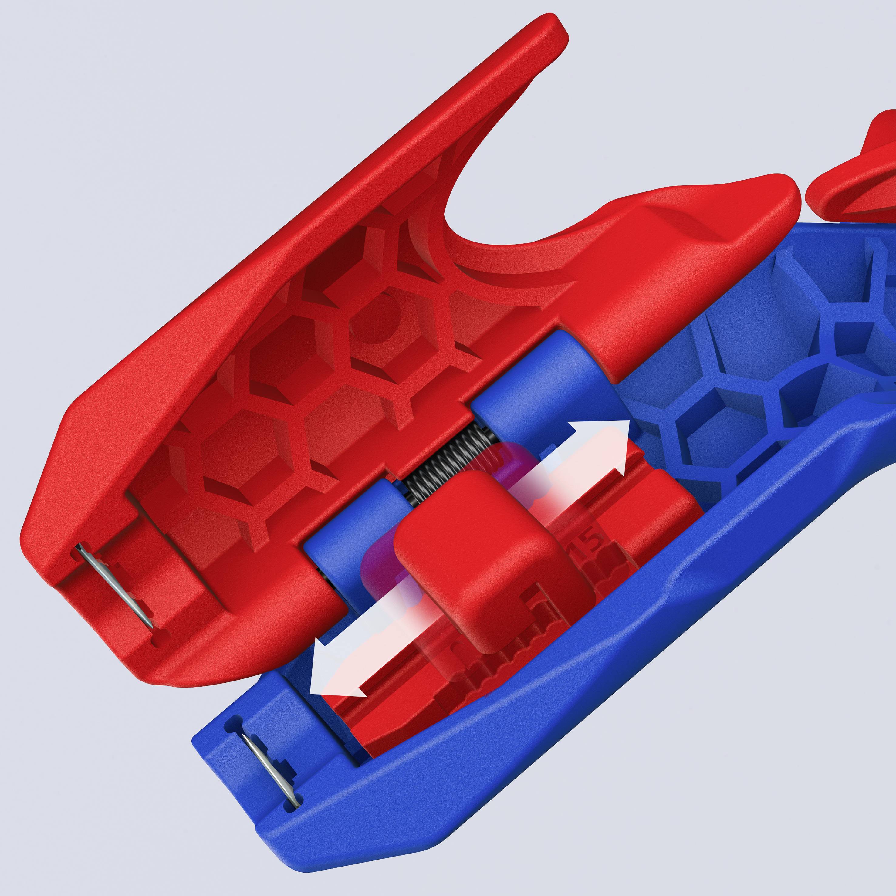 Une pièce en plastique rouge et bleue avec un ressort mécanique et des flèches blanches illustre le mécanisme de pression.