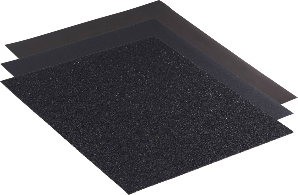 Trois feuilles de papier de verre superposées aux différentes granulométries, noir et gris foncé.