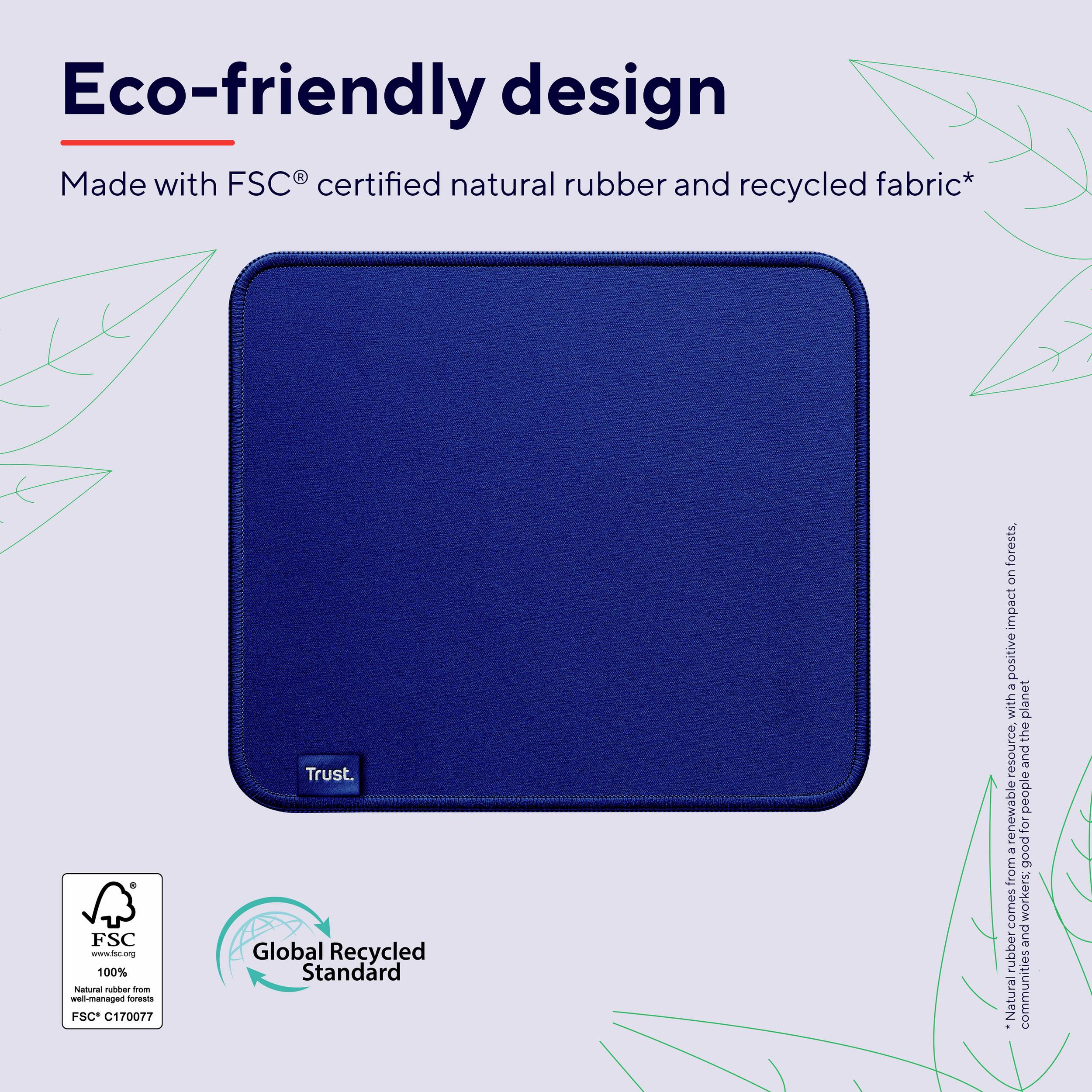 Un objet carré bleu avec un petit texte 'Trust' en bas à gauche. En haut, il est écrit 'Design éco-responsable', fabriqué en caoutchouc certifié FSC et en tissu recyclé.