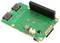 Une carte de circuit imprimé verte avec plusieurs ports, dont un connecteur noir. Probablement un accessoire pour Raspberry Pi.