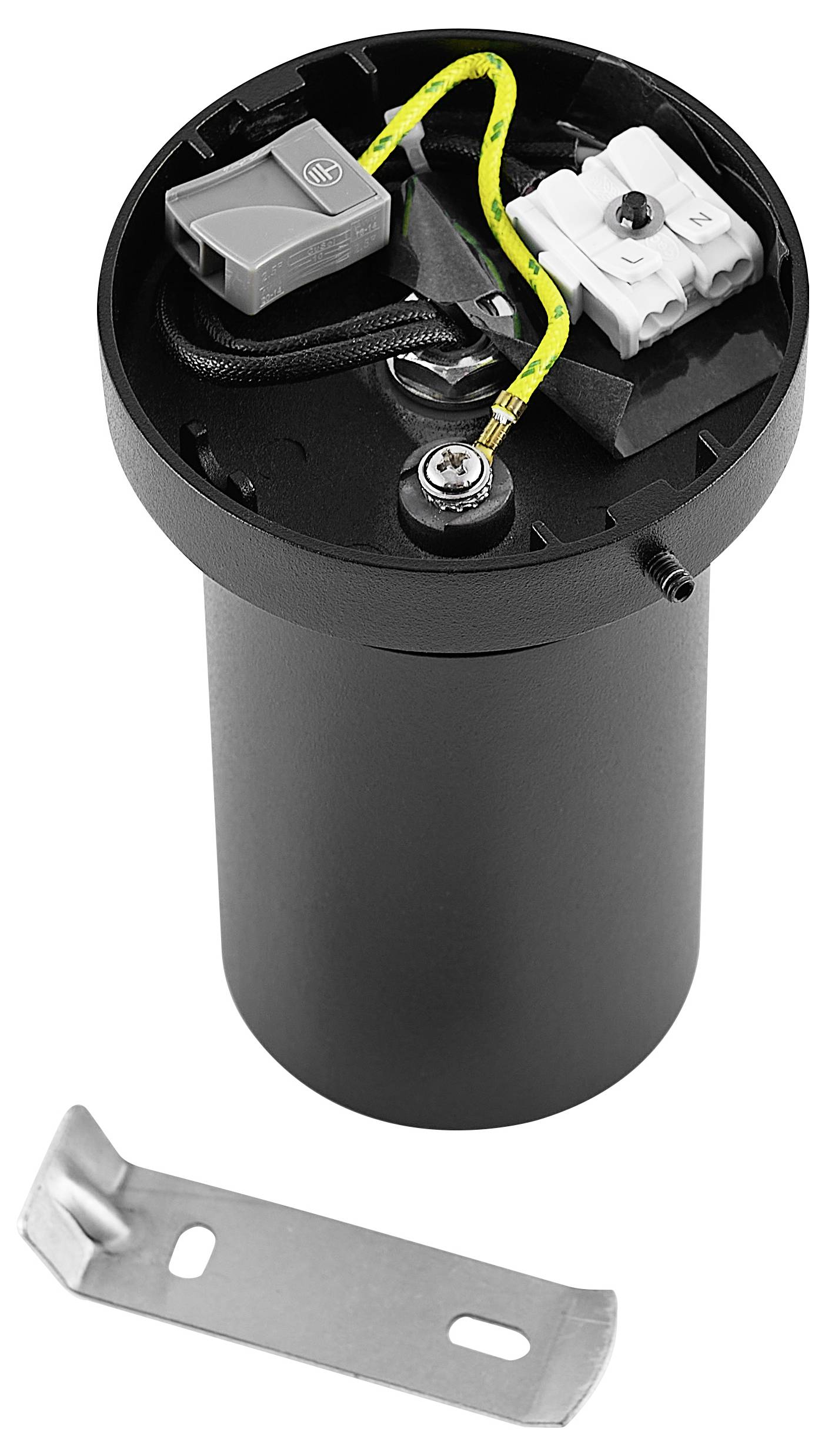 Un dispositif cylindrique noir avec son intérieur visible, des câbles et des connexions en haut. Un petit élément métallique est posé à côté.