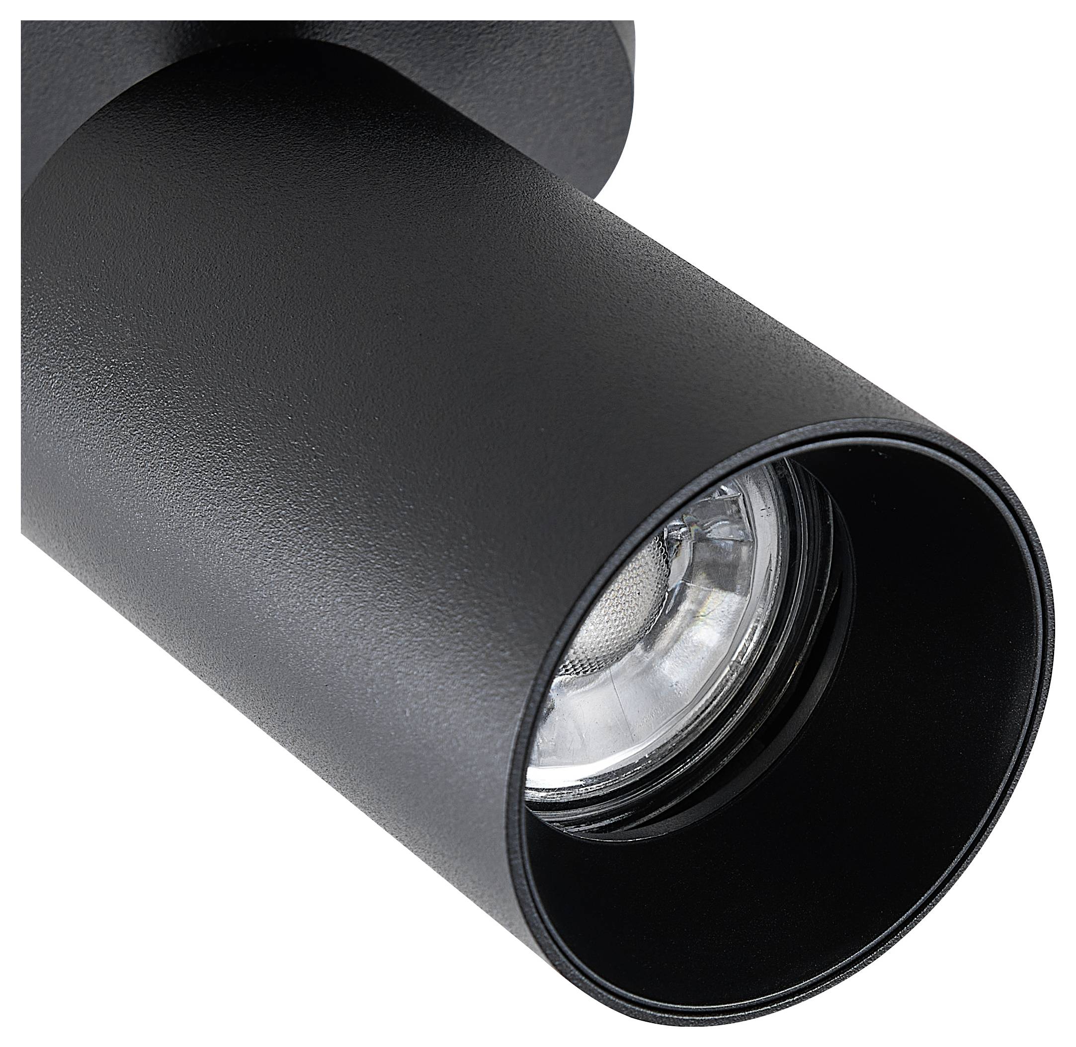 Un luminaire de plafond noir cylindrique avec un spot LED visible, monté au plafond, offre un éclairage ciblé.