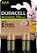Quatre piles rechargeables AAA Duracell dans leur emballage. Texte : 'Duracell Recharge 750 mAh', 'Conserve sa charge jusqu'à 5 ans'. Une mascotte rose sur l'emballage.