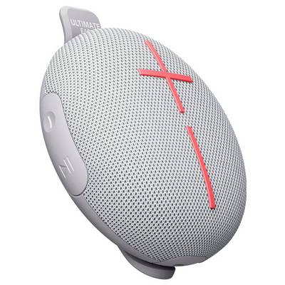 Enceinte portable Bluetooth grise avec un symbole plus et moins rouge. Forme ronde, surface texturée.