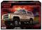 Voiture Chevrolet Blazer de Jim Hopper devant un ciel rouge, avec l'inscription « Hawkins Police Dept ». En arrière-plan : panneau de bienvenue « Welcome to Hawkins ». Emballage de Revell.