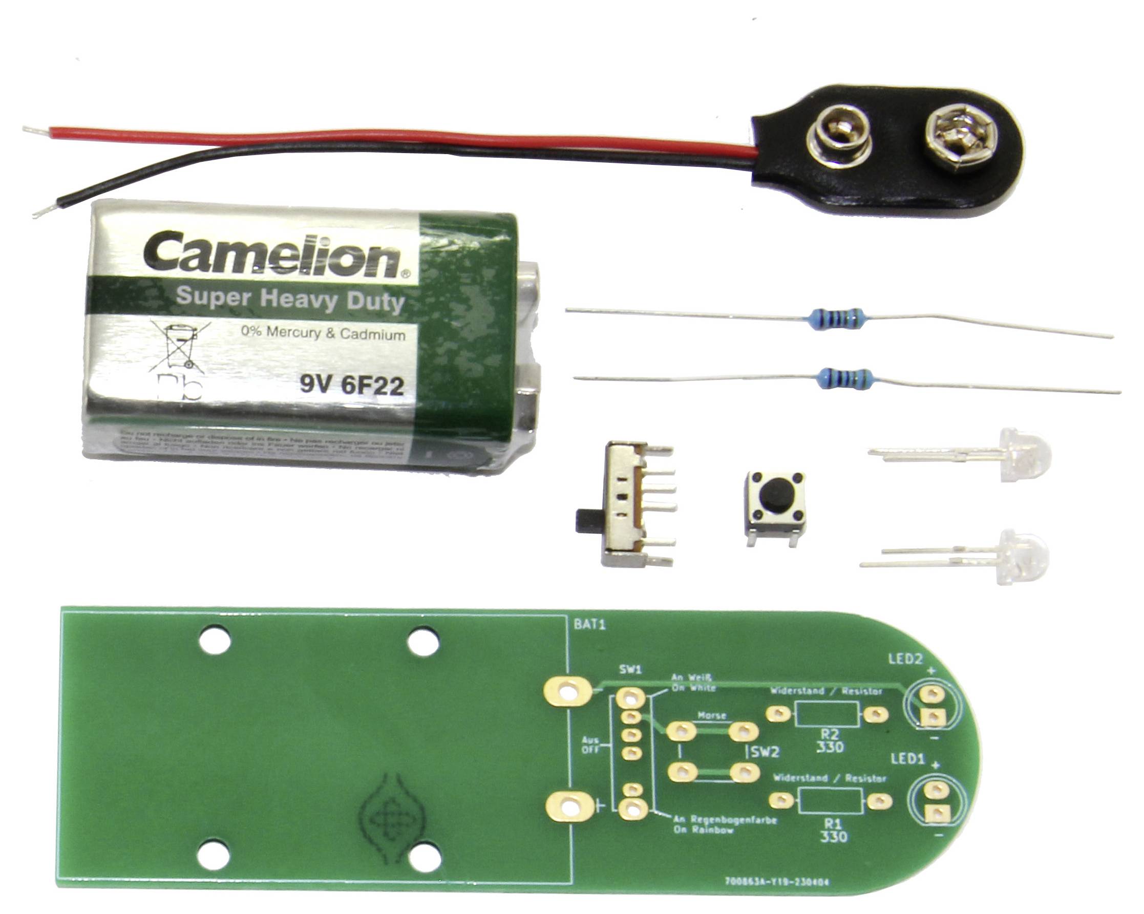 Kit électronique avec circuit imprimé, batterie, interrupteurs, résistances et LED. Composants à assembler et souder sur le circuit imprimé.