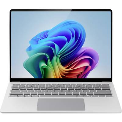 Un ordinateur portable avec un design abstrait coloré affiché sur l'écran, présentant une conception élégante et moderne avec un clavier gris.
