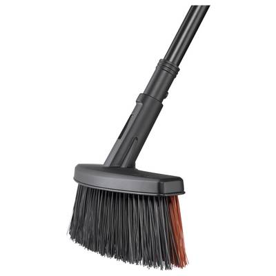 Balai à main noir avec des poils robustes, partiellement teintés en rouge, muni d'un manche noir. Adapté pour balayer les saletés.