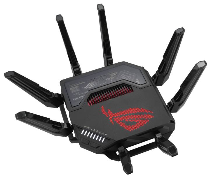 Un routeur WiFi noir avec huit antennes déployées. Un logo LED rouge se trouve sur sa surface supérieure.