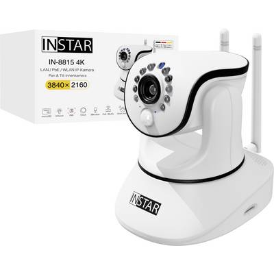 Caméra de surveillance blanche avec antennes, à côté d'un emballage portant l'inscription 'INSTAR IN-8815 4K Pan & Tilt Innenkamera'.