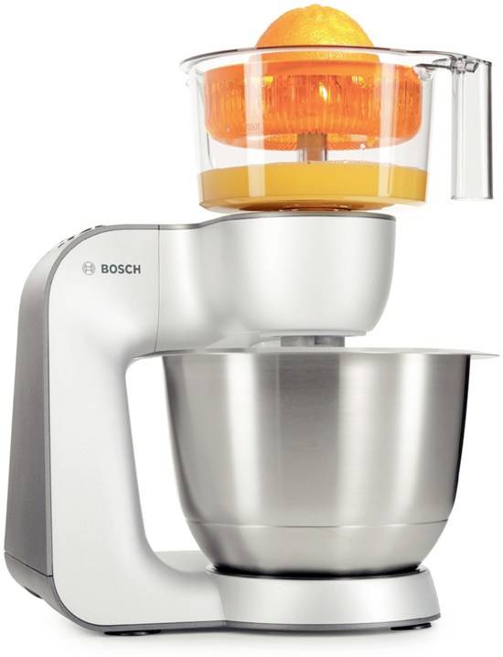Robot de cuisine avec presse-agrumes, sur lequel est pressée une demi-agrume. Appareil aspect inox.