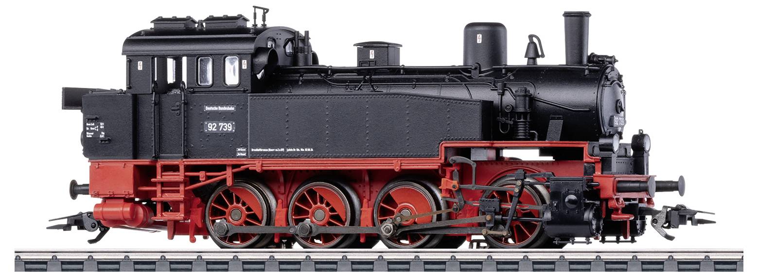Locomotive à vapeur noire et rouge sur rails, modèle détaillé avec des parties mécaniques visibles et l'inscription 'Brünigbahn'.