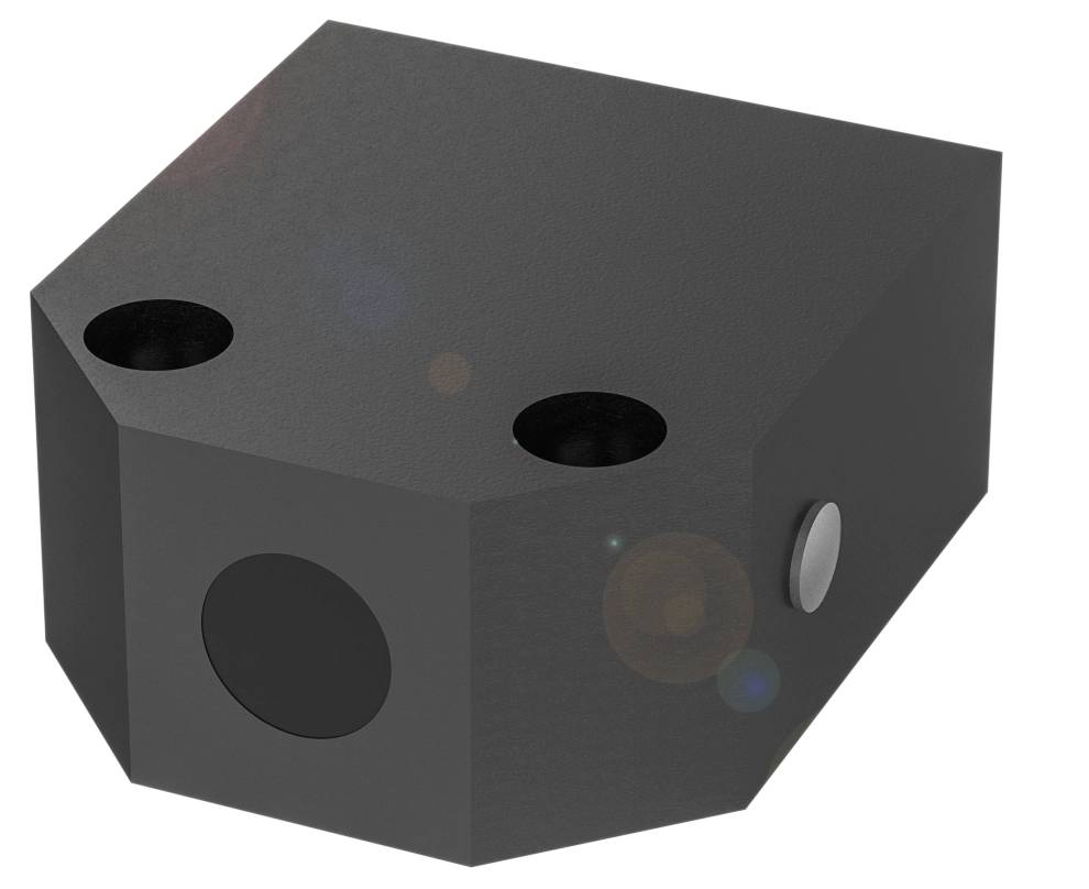 Un objet noir de forme parallélépipédique avec des angles arrondis et deux ouvertures rondes sur le dessus, une sur le côté droit.