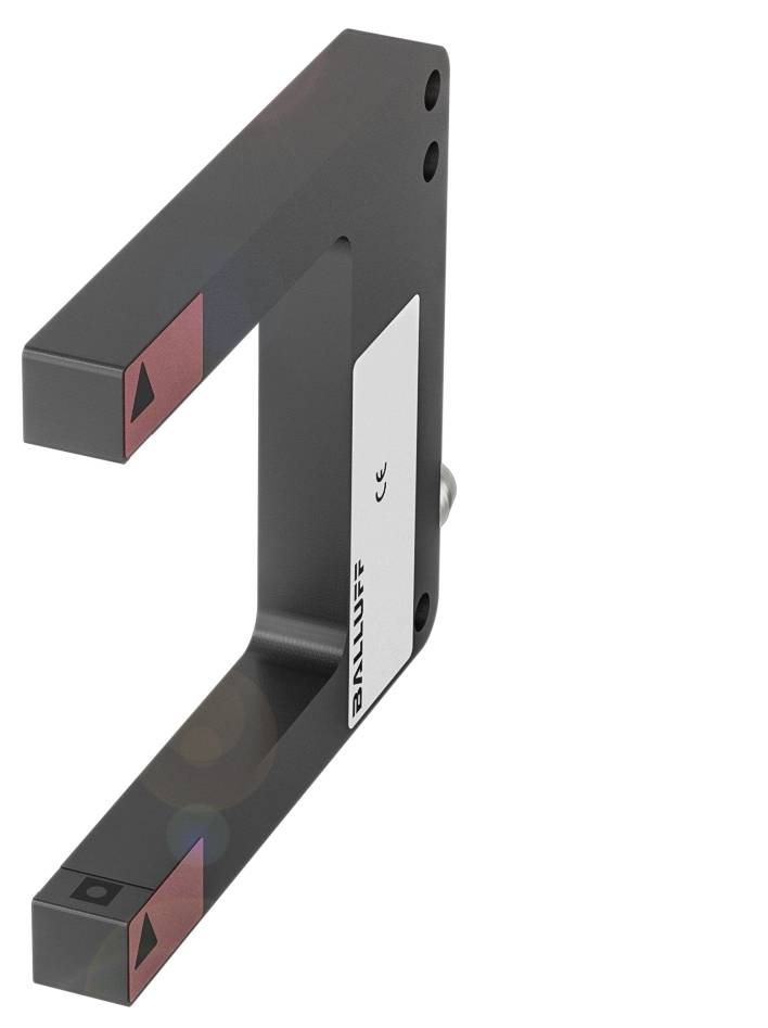 Un capteur en forme de U noir avec des accents rouges et l'inscription 'Balluff'. Adapté à la mesure de position précise dans les applications industrielles.