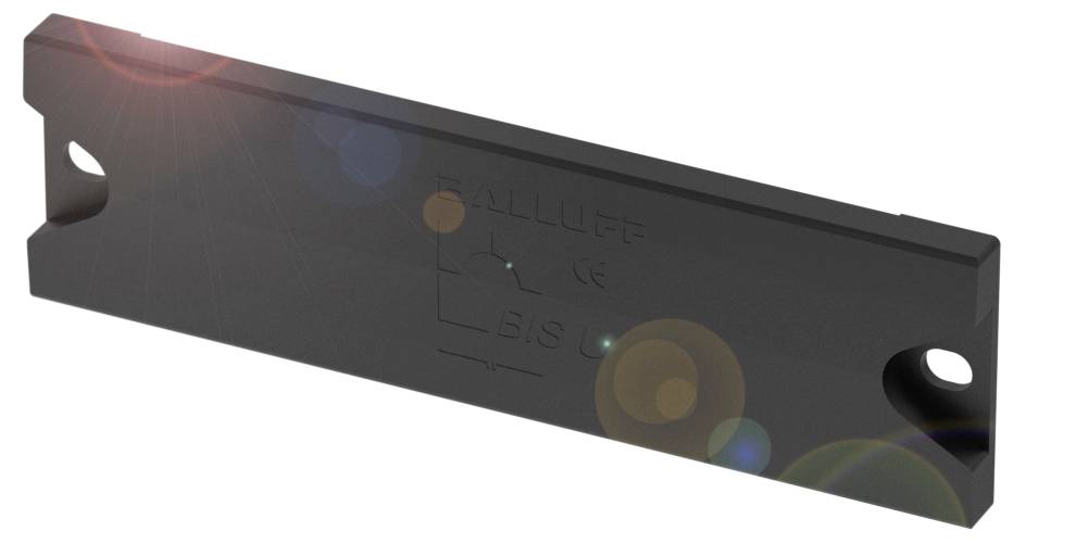 Une étiquette RFID rectangulaire noire avec deux trous de fixation aux extrémités. Le nom de marque est gravé sur la surface.