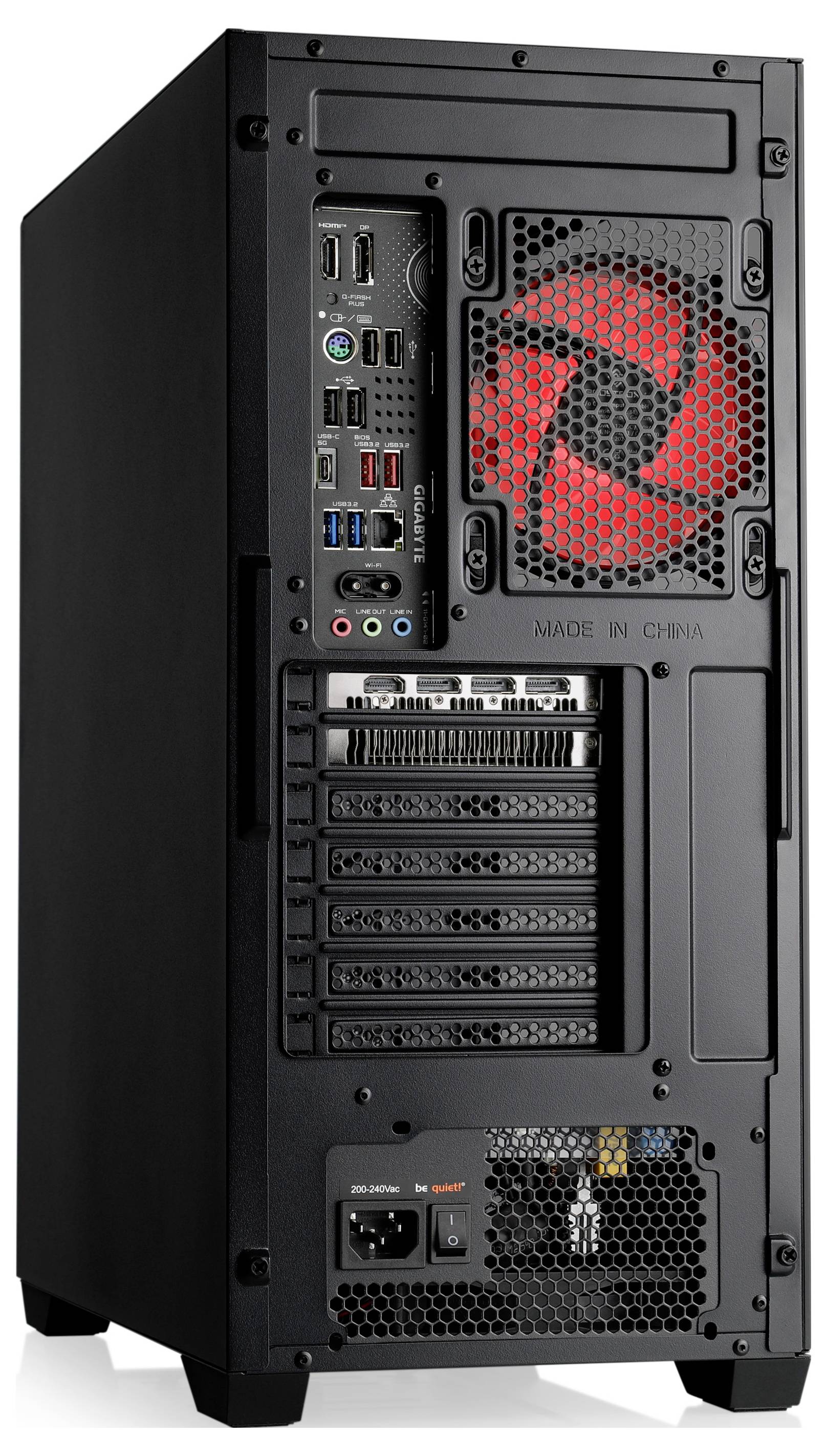 L'image montre l'arrière d'un boîtier d'ordinateur noir avec un ventilateur rouge, plusieurs ports USB et audio, ainsi que des emplacements d'extension.