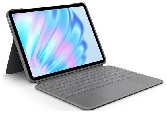 Tablette avec clavier connecté, positionnée en angle. L'écran affiche des motifs abstraits bleus et roses.