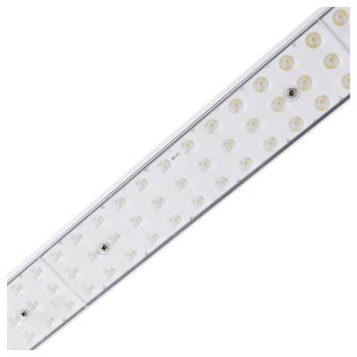 Gros plan d'un éclairage LED rectangulaire blanc avec plusieurs petites lumières LED circulaires sur une surface plane.