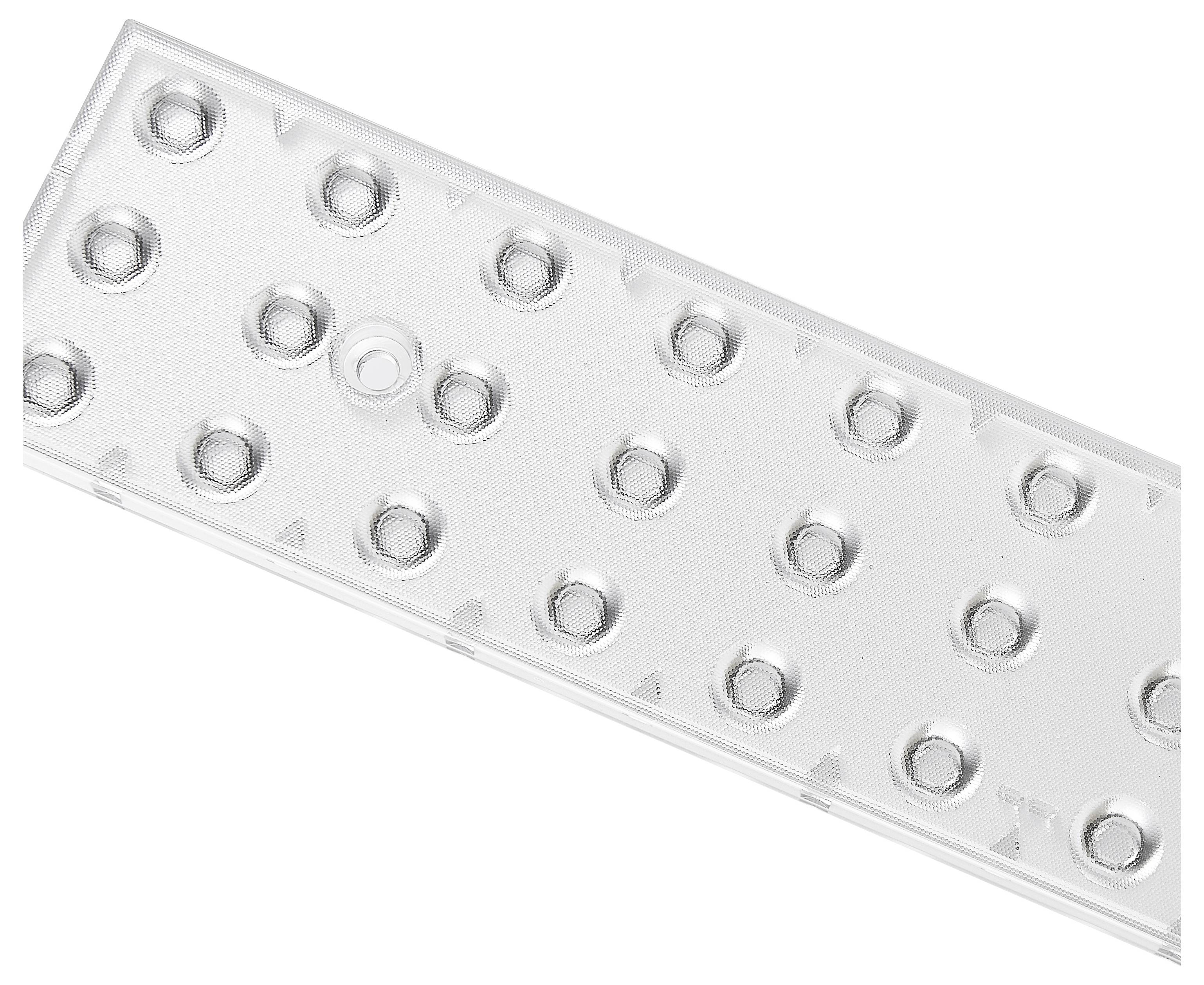 Un blister vide de forme rectangulaire avec des alvéoles rondes, probablement pour des comprimés ou des gélules, est posé en diagonale.