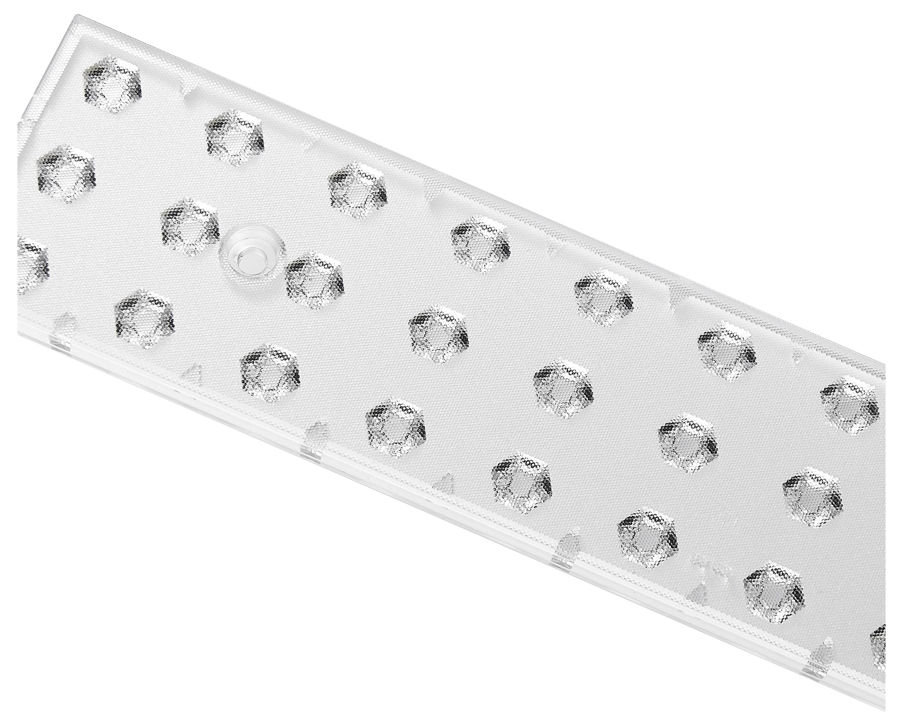Une plaque en plastique transparent avec des reliefs hexagonaux répartis uniformément sur la surface.