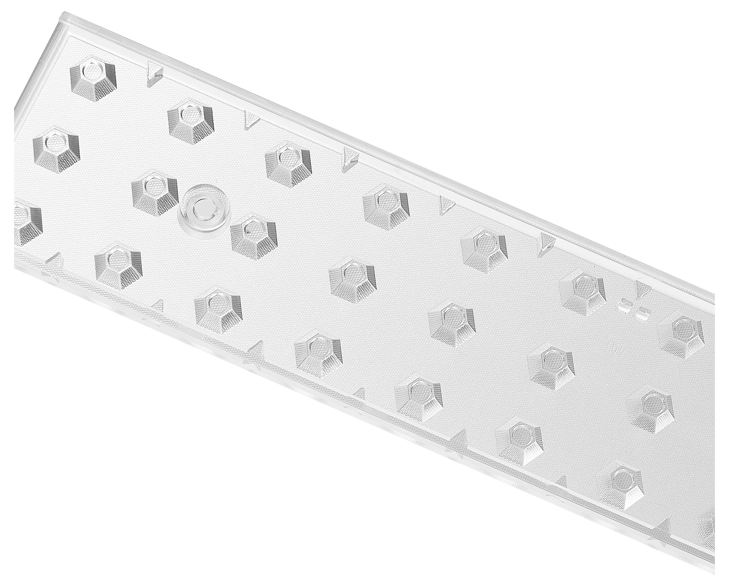 Une pièce en plastique transparente avec une série de petites protubérances hexagonales, probablement un composant technique.