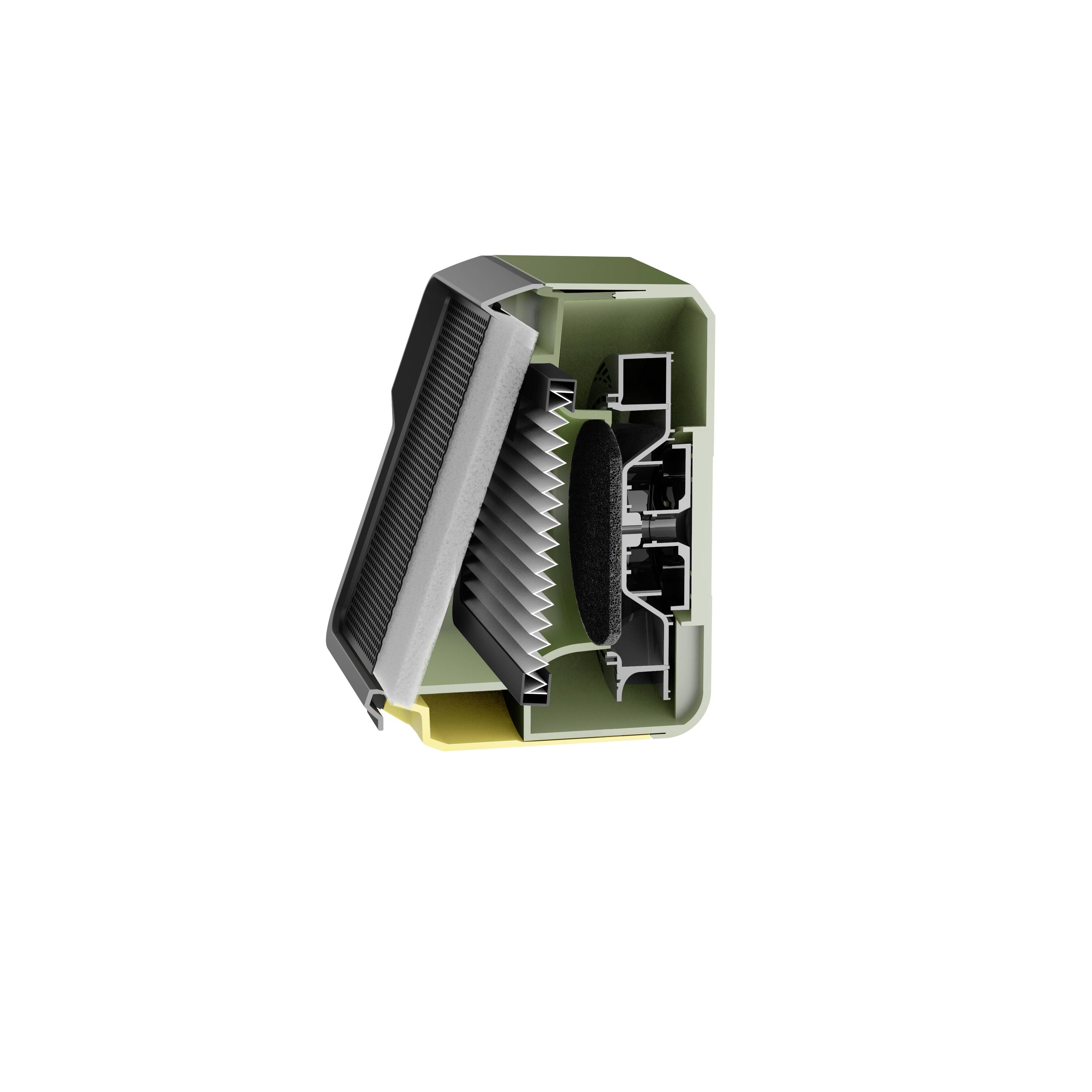 Un petit appareil en plastique vert et noir, partiellement démonté, révélant des composants internes complexes avec des fentes et des connecteurs.