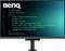 Un écran d'ordinateur affichant un éditeur de code avec du code JavaScript sur un fond bleu-vert. Le moniteur porte la marque « BenQ » dessus.