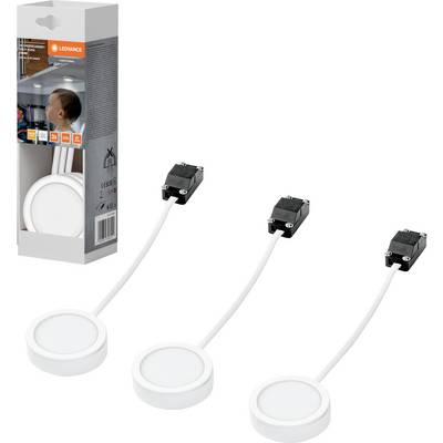 Trois petits projecteurs LED ronds blancs avec câbles attachés et connecteurs noirs, présentés à côté de leur emballage de vente au détail sur un fond blanc.