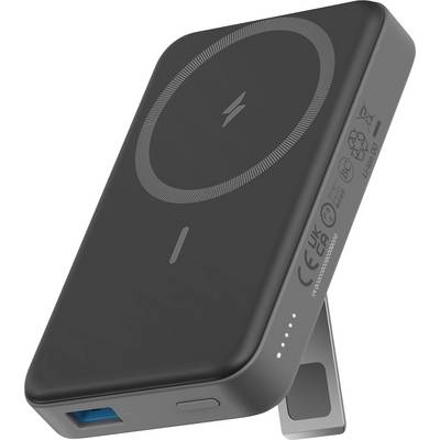 Une batterie externe noire portable avec un anneau pour la charge sans fil sur le dessus, un port USB sur le côté, et un support incliné pour la stabilité.