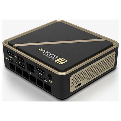 Un ordinateur compact noir et or avec plusieurs ports sur les côtés, conçu pour le gaming et les applications multimédias.