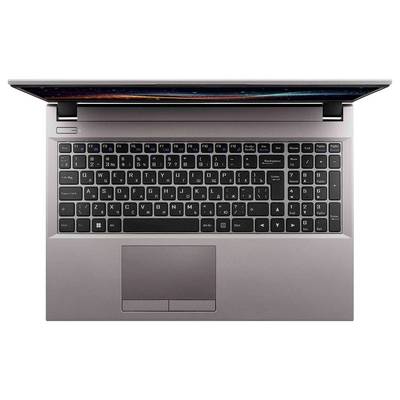 Un ordinateur portable argenté vu de dessus, montrant un clavier noir et un pavé tactile. L'écran est partiellement visible, affichant un motif coloré.