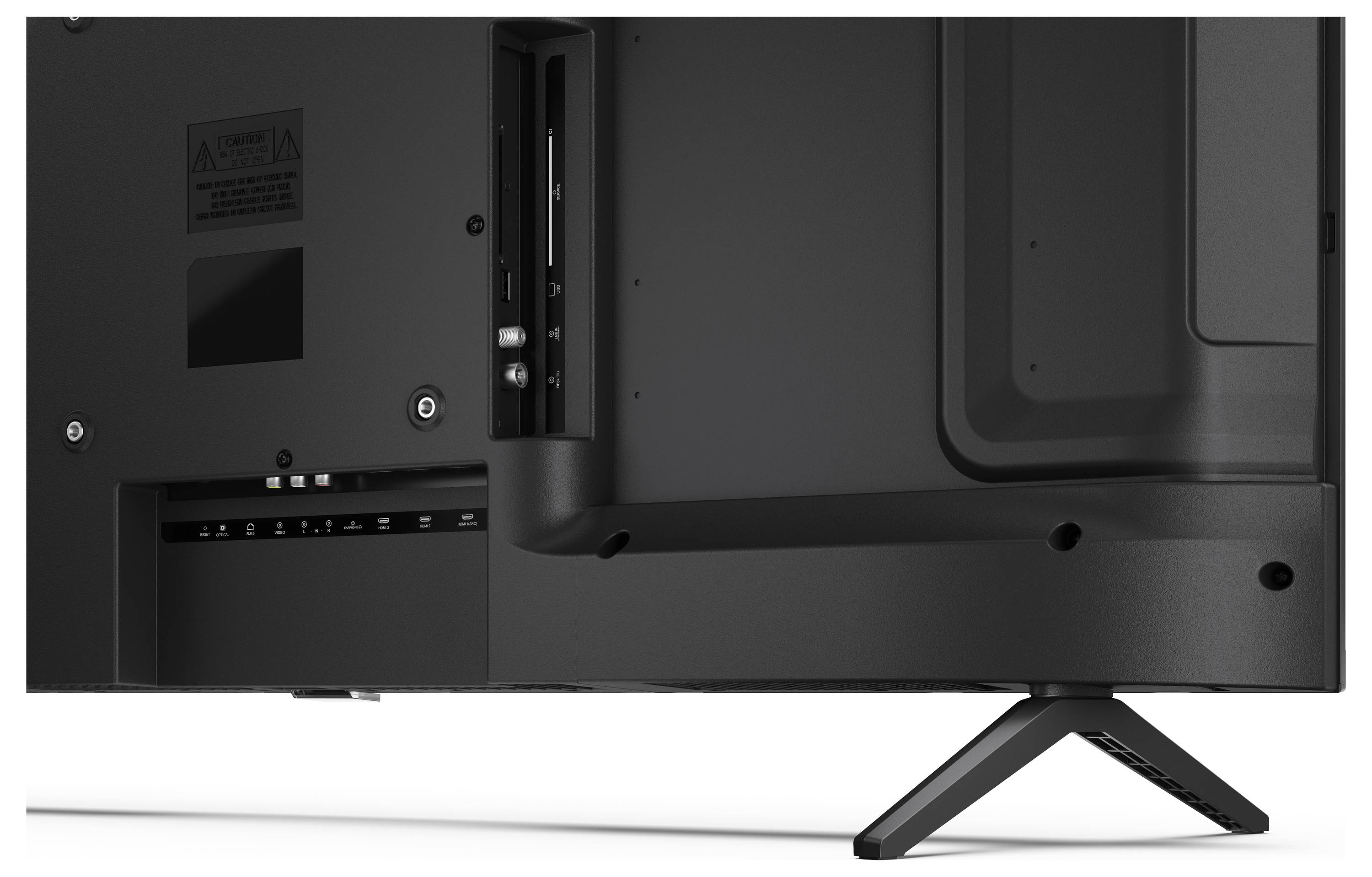 Le dos d'un téléviseur à écran plat montrant divers ports d'entrée, notamment HDMI et USB, avec un support soutenant le coin inférieur droit.