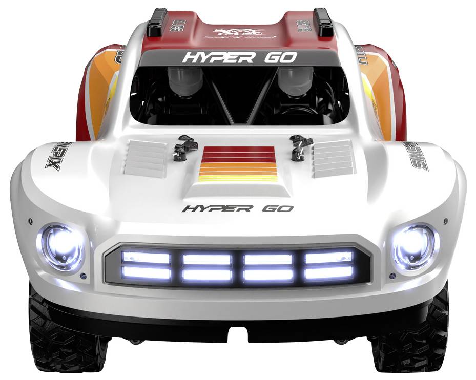 Un camion de course jouet avec le texte audacieux « HYPER GO » sur l'avant, présentant des designs vibrants en rouge et orange avec des phares illuminés.