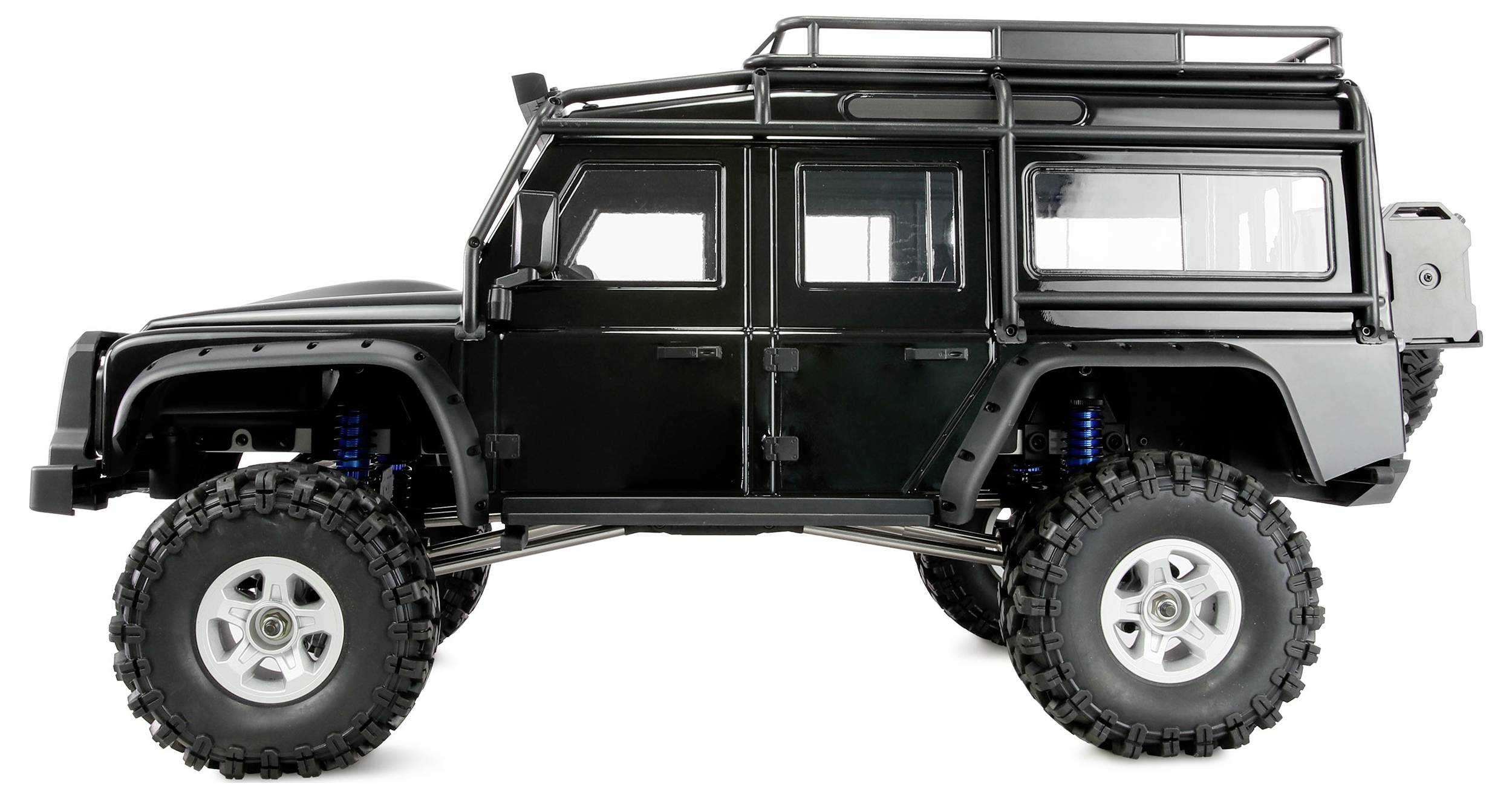 Modèle réduit d'un véhicule tout-terrain noir avec de grandes roues et un porte-bagages de toit, vu de côté.