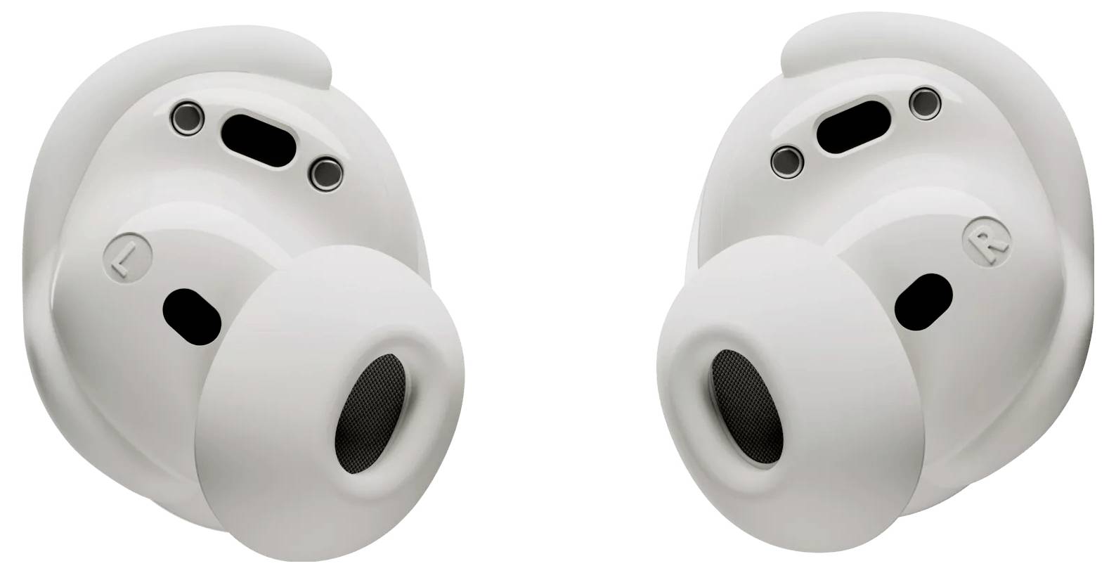 Deux écouteurs sans fil blancs, montrant leur face intérieure avec des embouts et des capteurs visibles, conçus pour un ajustement confortable dans l'oreille et une utilisation audio.