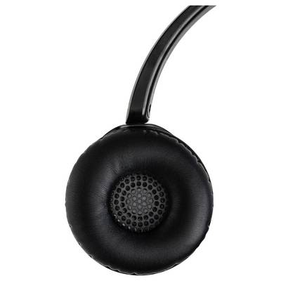 Casque audio noir circumaural avec coussinets d'oreille rembourrés et grille de haut-parleur perforée, vue de profil.